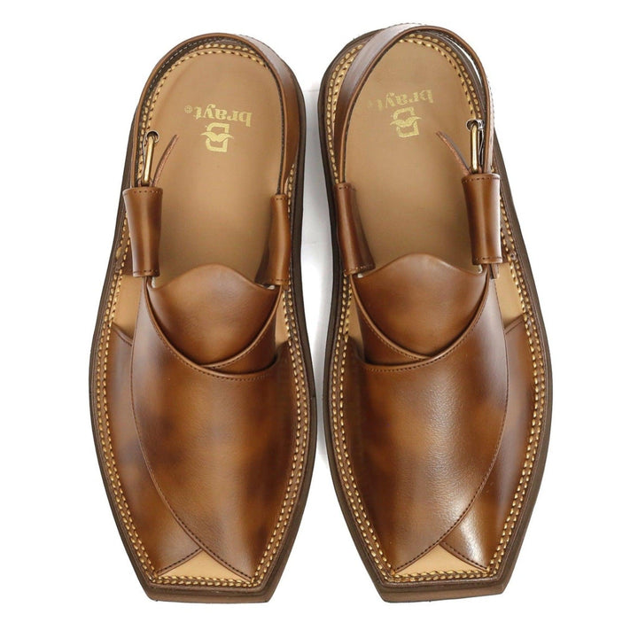Step into timeless elegance with brayt Peshawari Chappals, Kaptaan Chappals, and Kheri Chappals for men. Explore our collection of handcrafted Peshawari sandals and Kohati Chappals, designed to exude style and comfort. Discover the finest selection of gents' Norozi Chappals that embody the rich cultural heritage of Pakistan. Shop now and embrace the essence of traditional footwear craftsmanship.