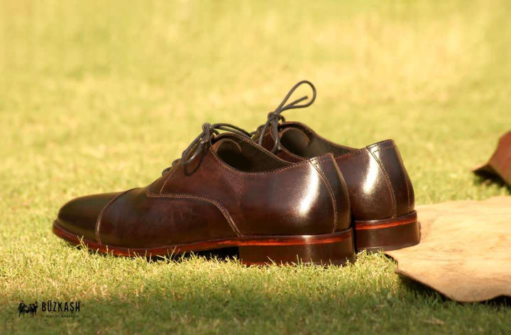 Cap-toe Oxford shoes, hand-stitched, Calf leather shoes, Double Monk Strap shoes, Brown colour leather shoes, patina shoes Pakistan,shoe size chart, shoe sizes for men, now available in Pakistan. Genuine leather, handmade shoes, shoes for men in Pakistan, handmade shoes in Pakistan, shoes for wedding, Buzkashi, imported leather, leather shoes for men, leather shoes in Pakistan, leather shoes price, leather gifts, leather shoes for office, stylish men shoes, Pakistan No. 1, best selling shoes of 2021